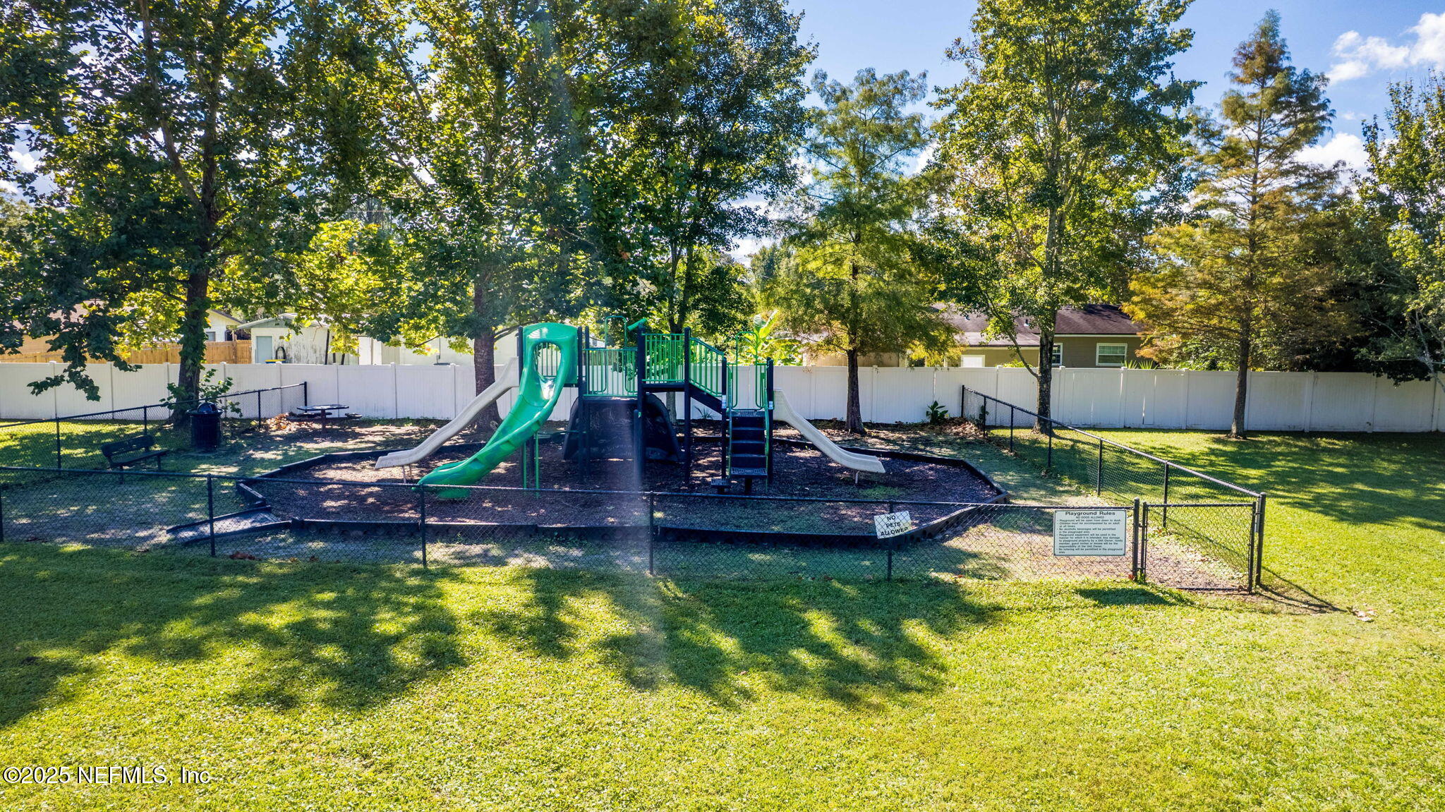 7920 Merrill Road, Unit 1206 Jacksonville, FL 32277 - Photo 24 of 35 a view of a house with swimming pool and a yard