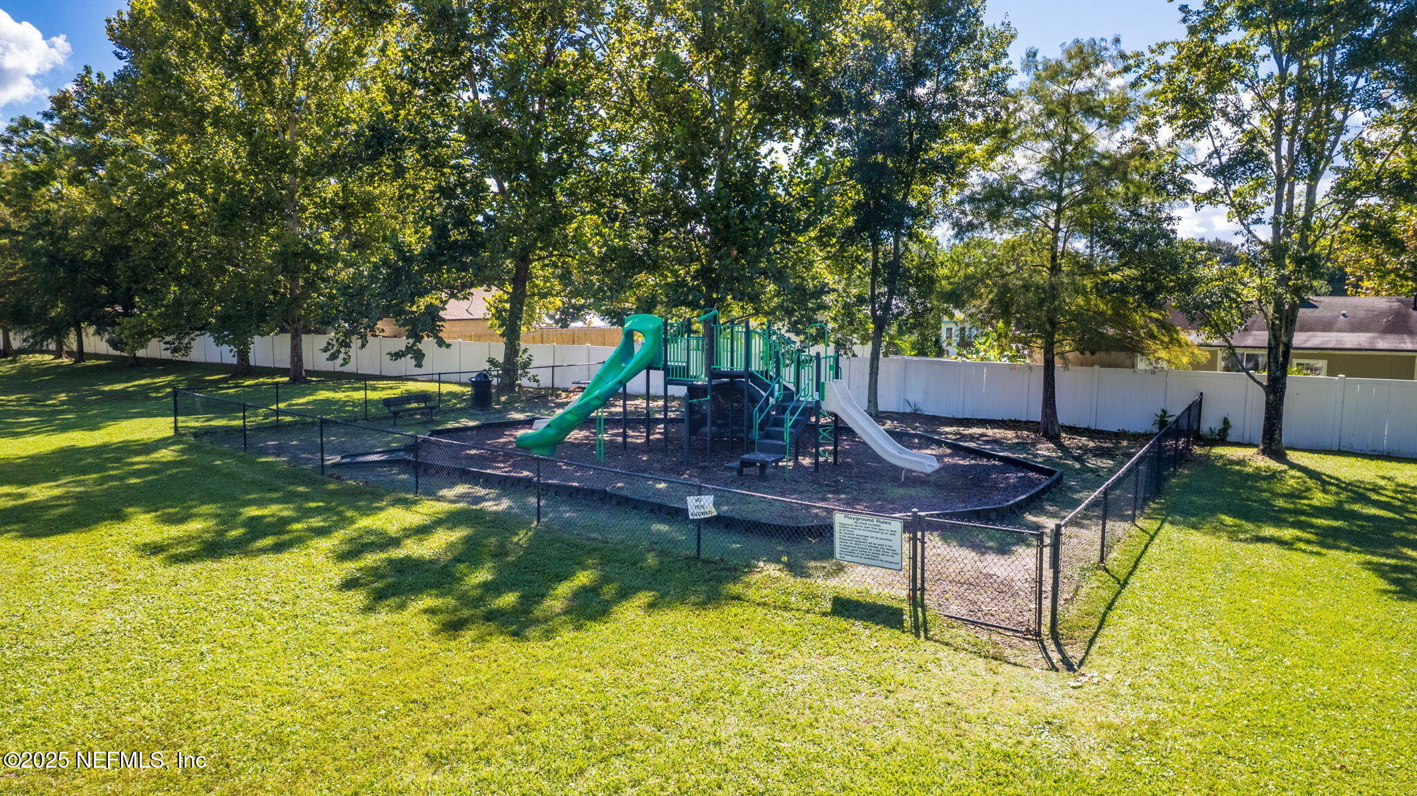 7920 Merrill Road, Unit 1206 Jacksonville, FL 32277 - Photo 25 of 35 a swimming pool with outdoor seating and yard