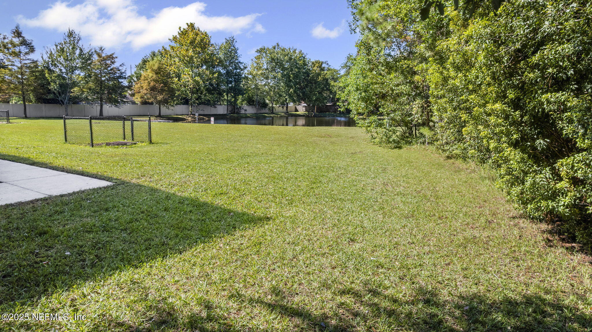 7920 Merrill Road, Unit 1206 Jacksonville, FL 32277 - Photo 26 of 35 a view of a green field with a tree