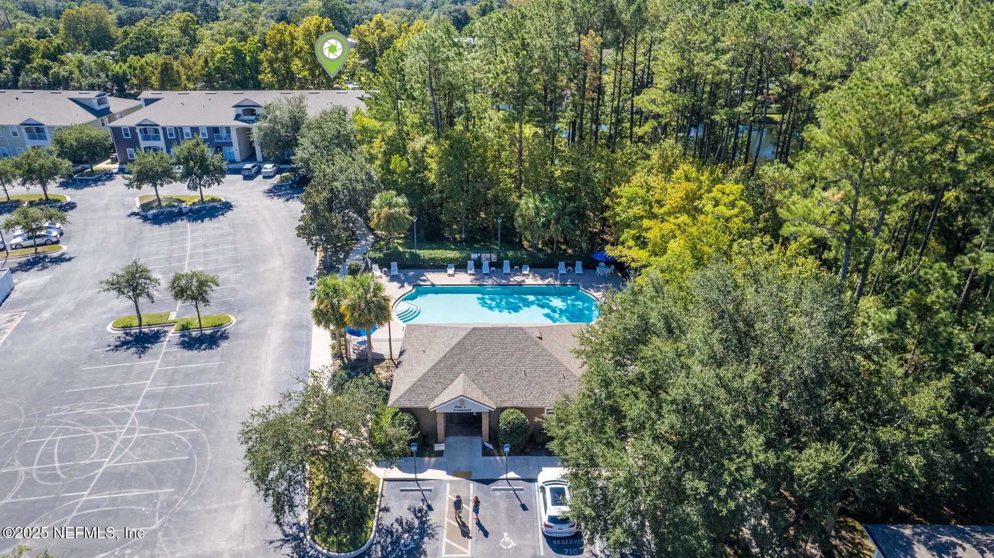 7920 Merrill Road, Unit 1206 Jacksonville, FL 32277 - Photo 30 of 35 an aerial view of a house with yard swimming pool and outdoor seating