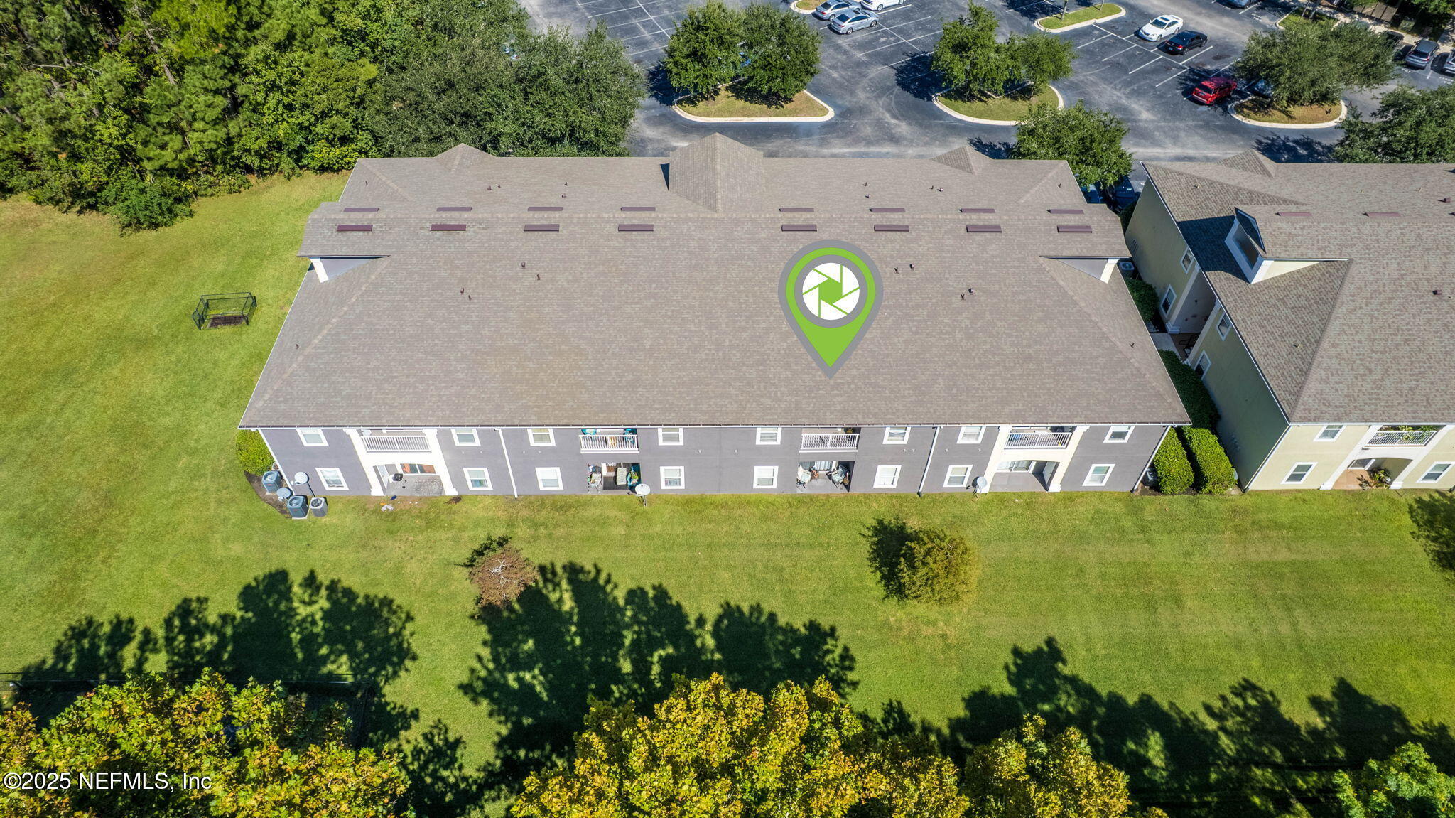7920 Merrill Road, Unit 1206 Jacksonville, FL 32277 - Photo 32 of 35 an aerial view of a house with a swimming pool