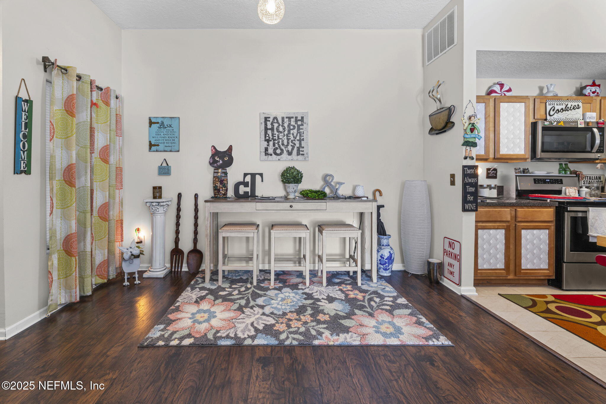 7920 Merrill Road, Unit 1206 Jacksonville, FL 32277 - Photo 5 of 35 a living room with furniture and a flat screen tv