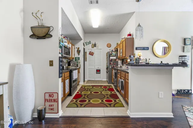 a view of entryway with furniture and wooden floor