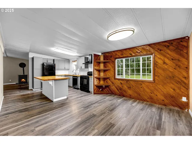 a view of kitchen with cabinets and wooden floor