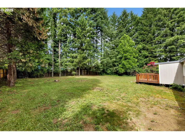 a backyard of a house with lots of green space