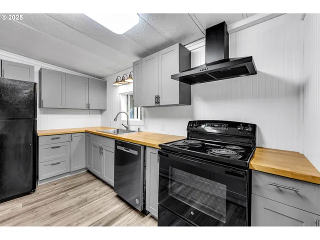 a kitchen with a sink stove and refrigerator