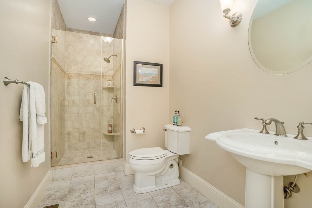 19 Lyon Road Brookline, MA 02467 - Photo 19 of 41 a bathroom with a sink a toilet and shower