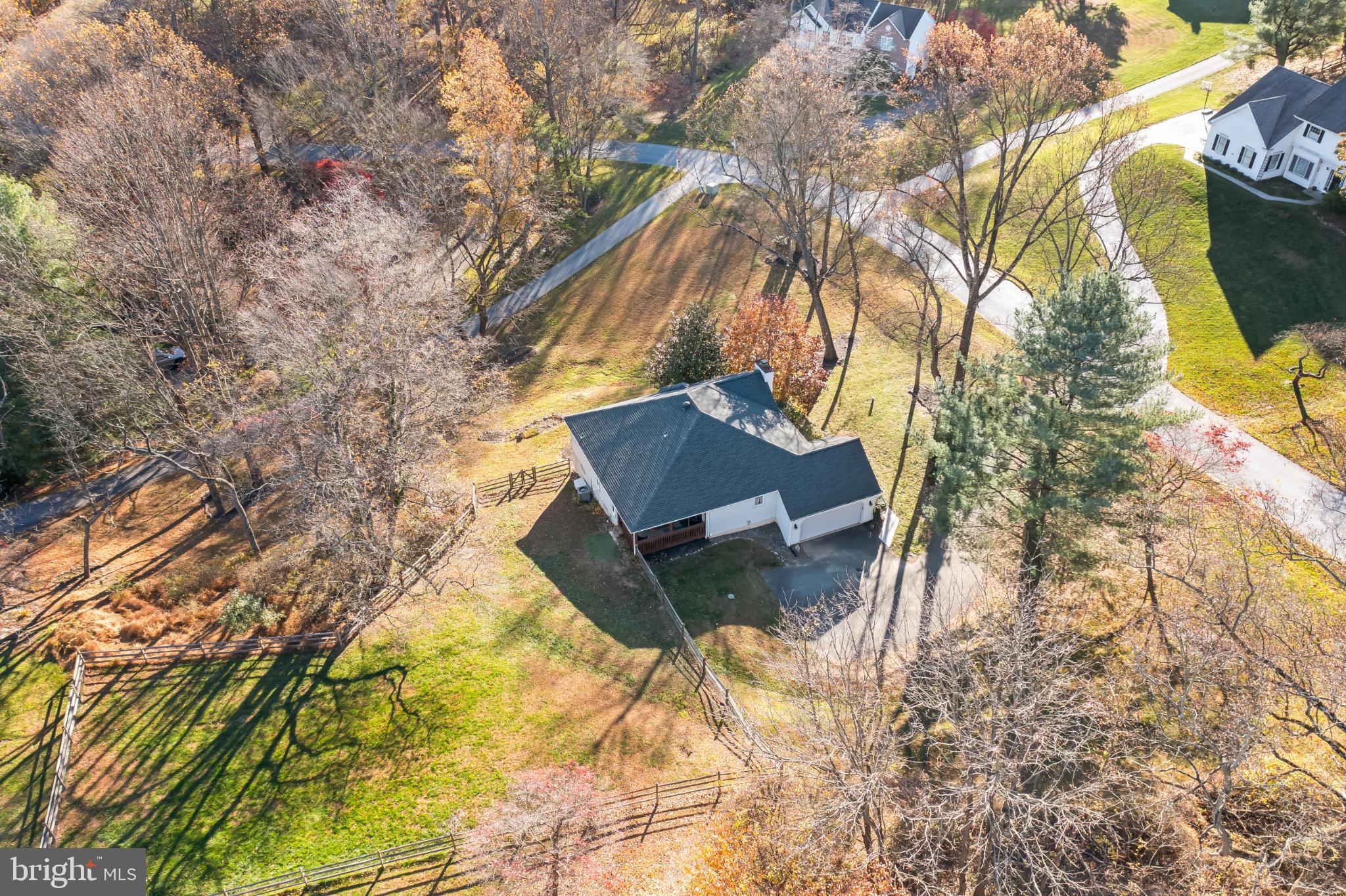 208 Wills Farm Road Oxford, PA 19363 - Photo 3 of 12 a backyard of a house with table and chairs under an umbrella