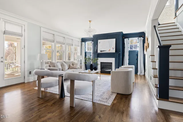 a kitchen with kitchen island granite countertop a sink cabinets and wooden floor