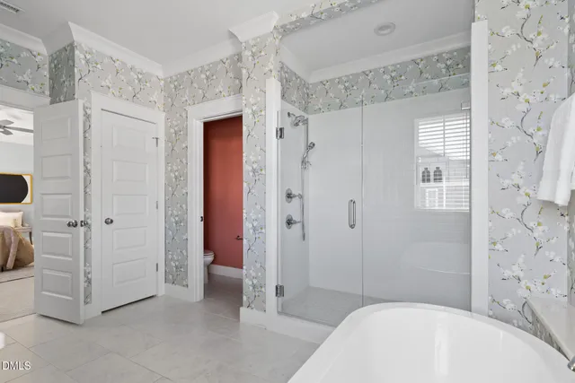 a view of a house with a small yard and plants