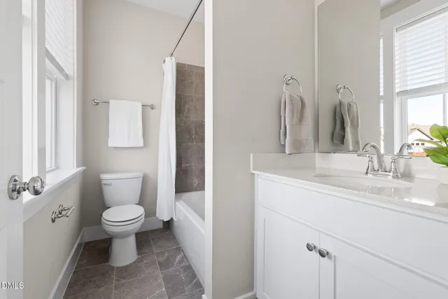 an aerial view of a house with yard swimming pool and outdoor seating