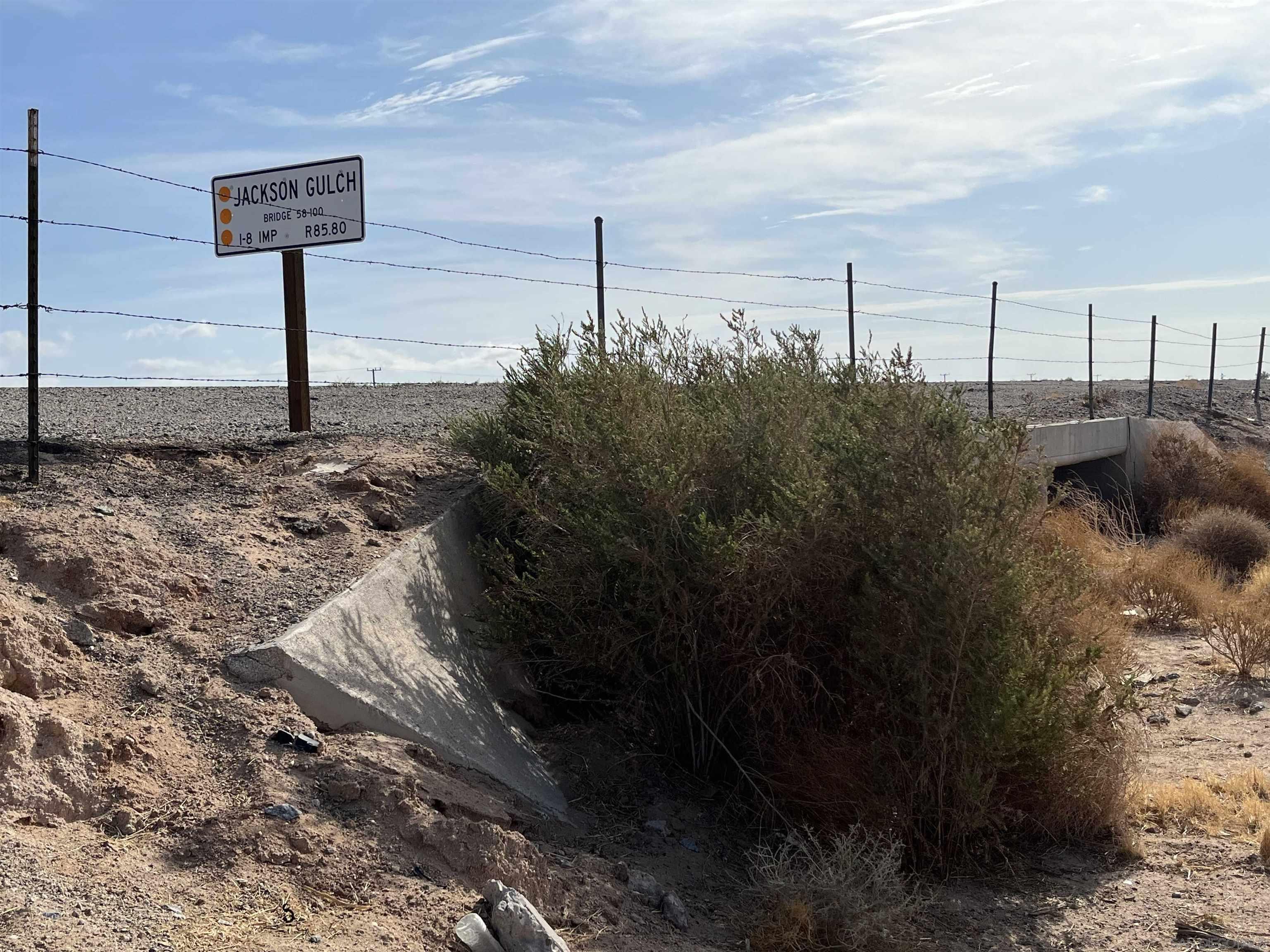 1 Frontage Road Winterhaven, CA 92283 - Photo 6 of 11 a street sign on a sidewalk next to a road