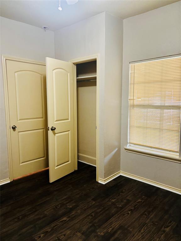 905 Isbell Road Fort Worth, TX 76114 - Photo 24 of 30 a view of empty room with wooden floor and a window