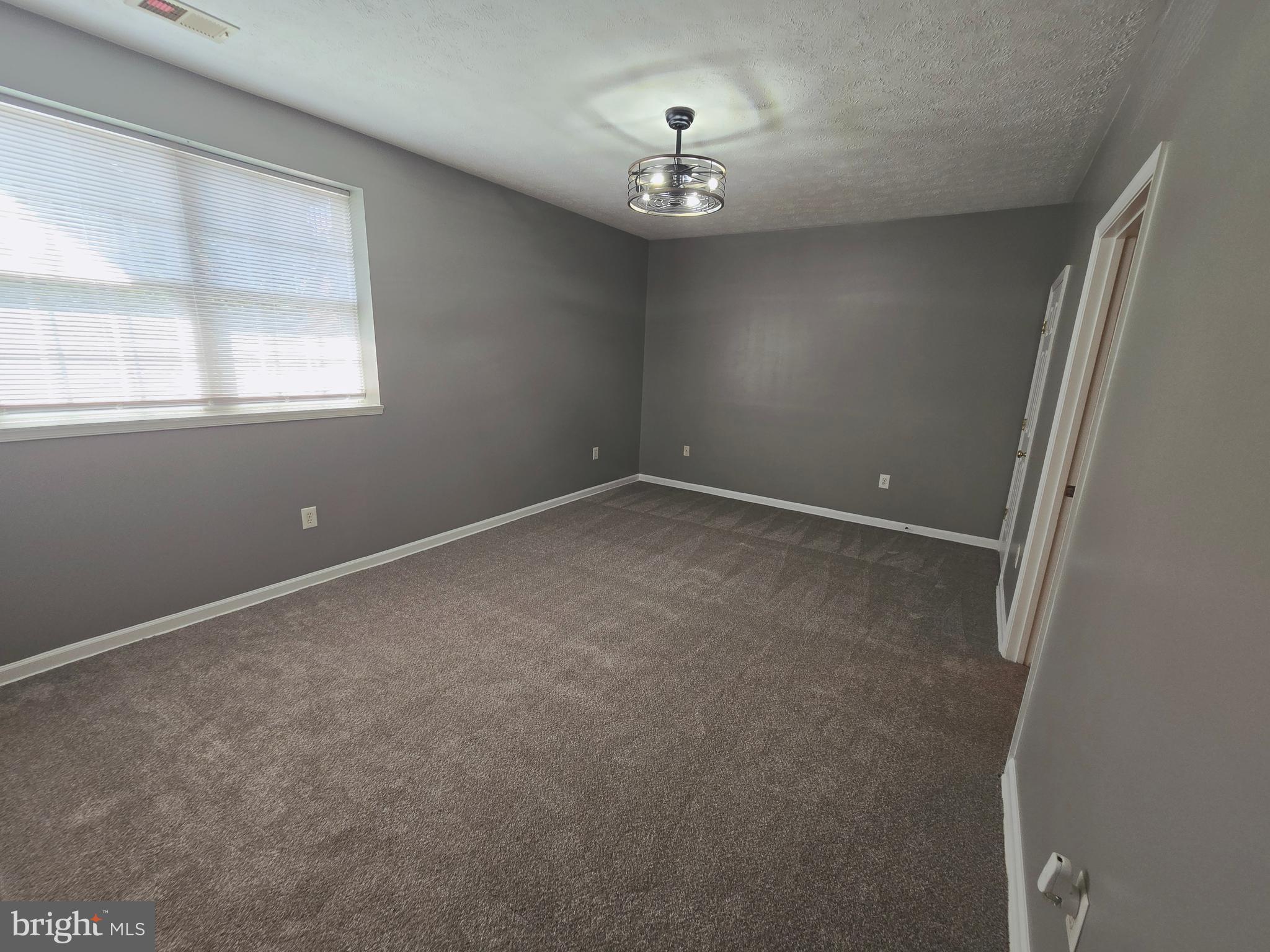 118 Heather Stone Way, Unit 80 Glen Burnie, MD 21061 - Photo 19 of 27 a view of an empty room with a window