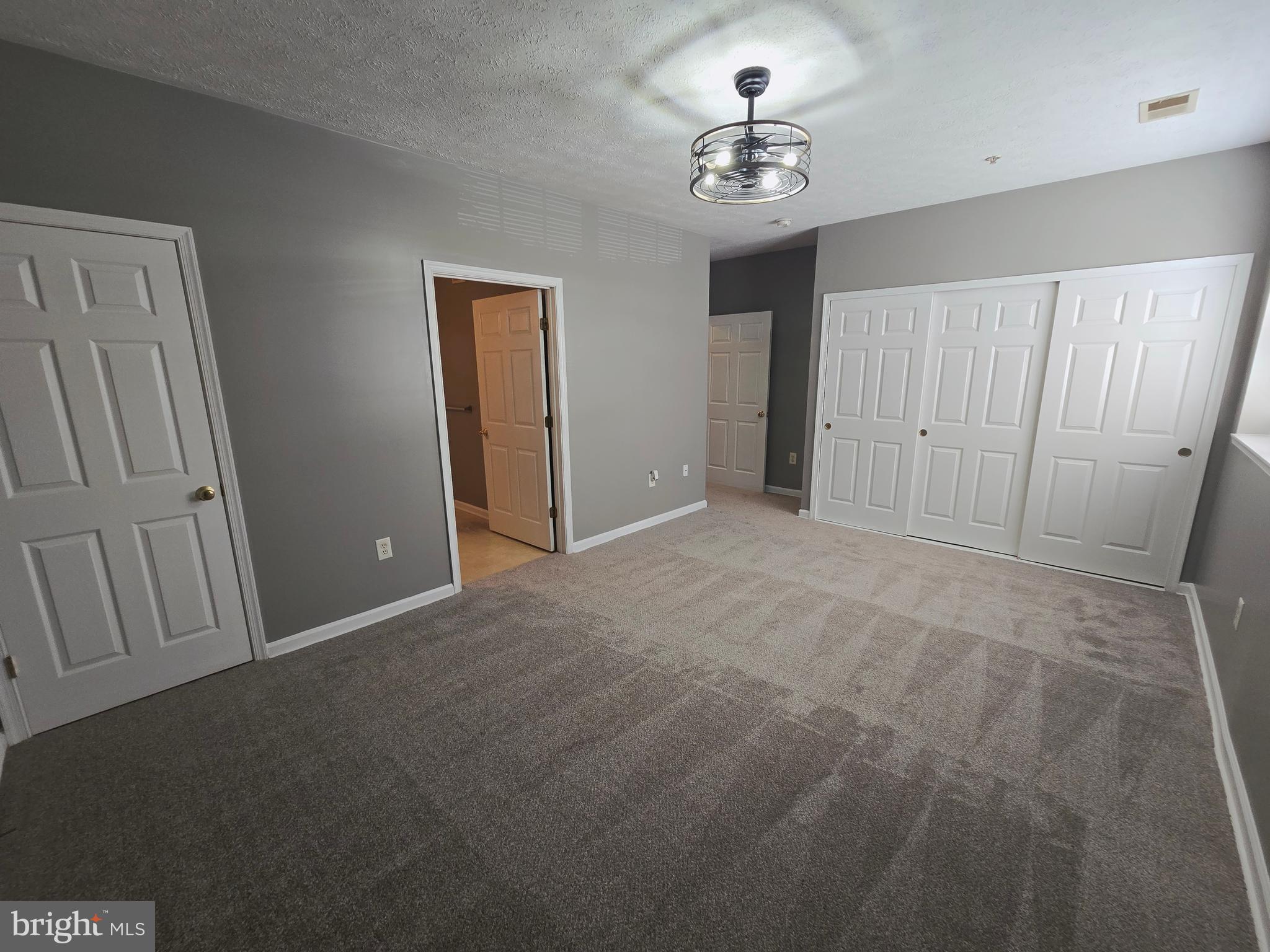 118 Heather Stone Way, Unit 80 Glen Burnie, MD 21061 - Photo 20 of 27 a view of an empty room with a chandelier