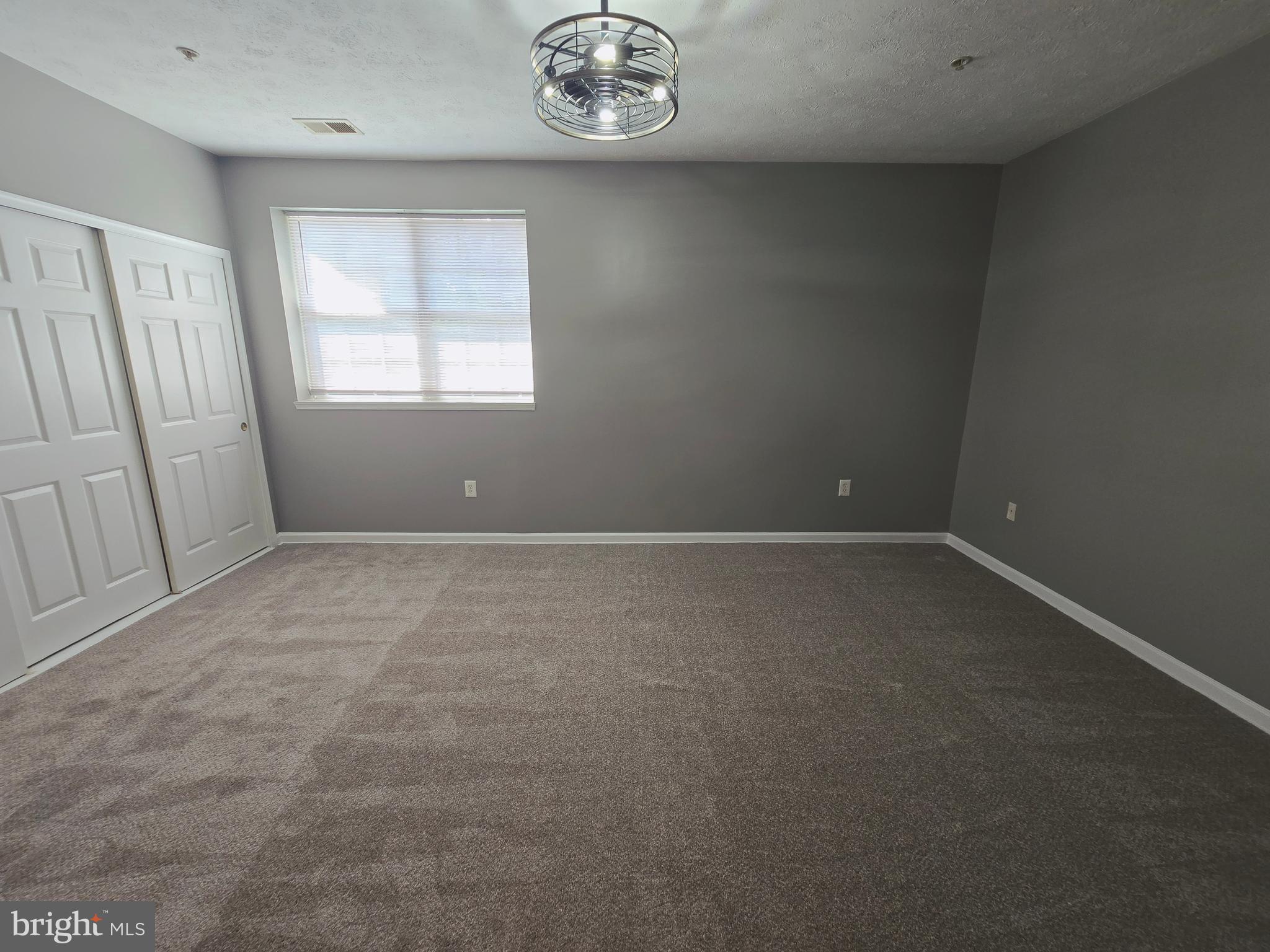 118 Heather Stone Way, Unit 80 Glen Burnie, MD 21061 - Photo 23 of 27 an empty room with a window
