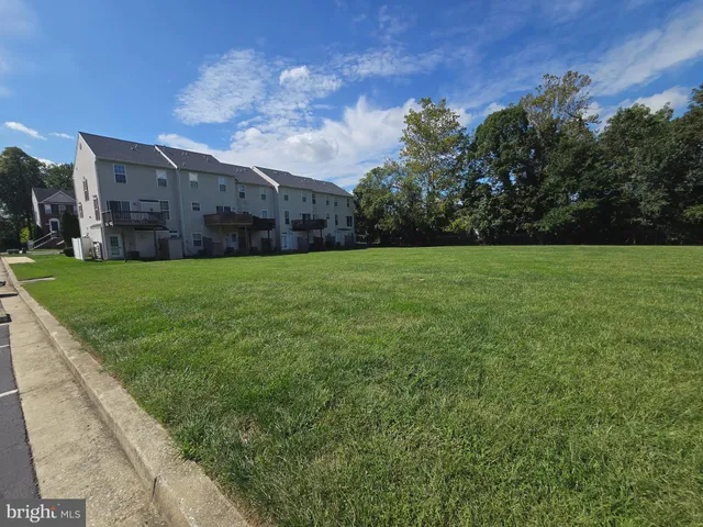 a view of a patio with a yard