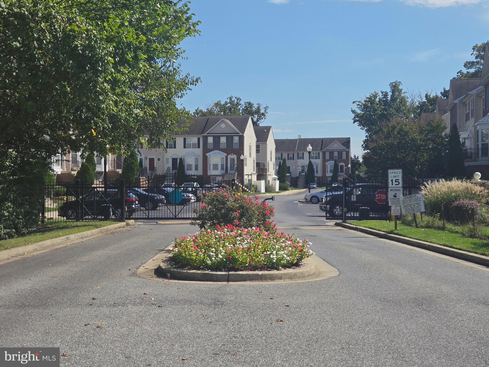 118 Heather Stone Way, Unit 80 Glen Burnie, MD 21061 - Photo 27 of 27 a view of a street with a fountain plants and large trees