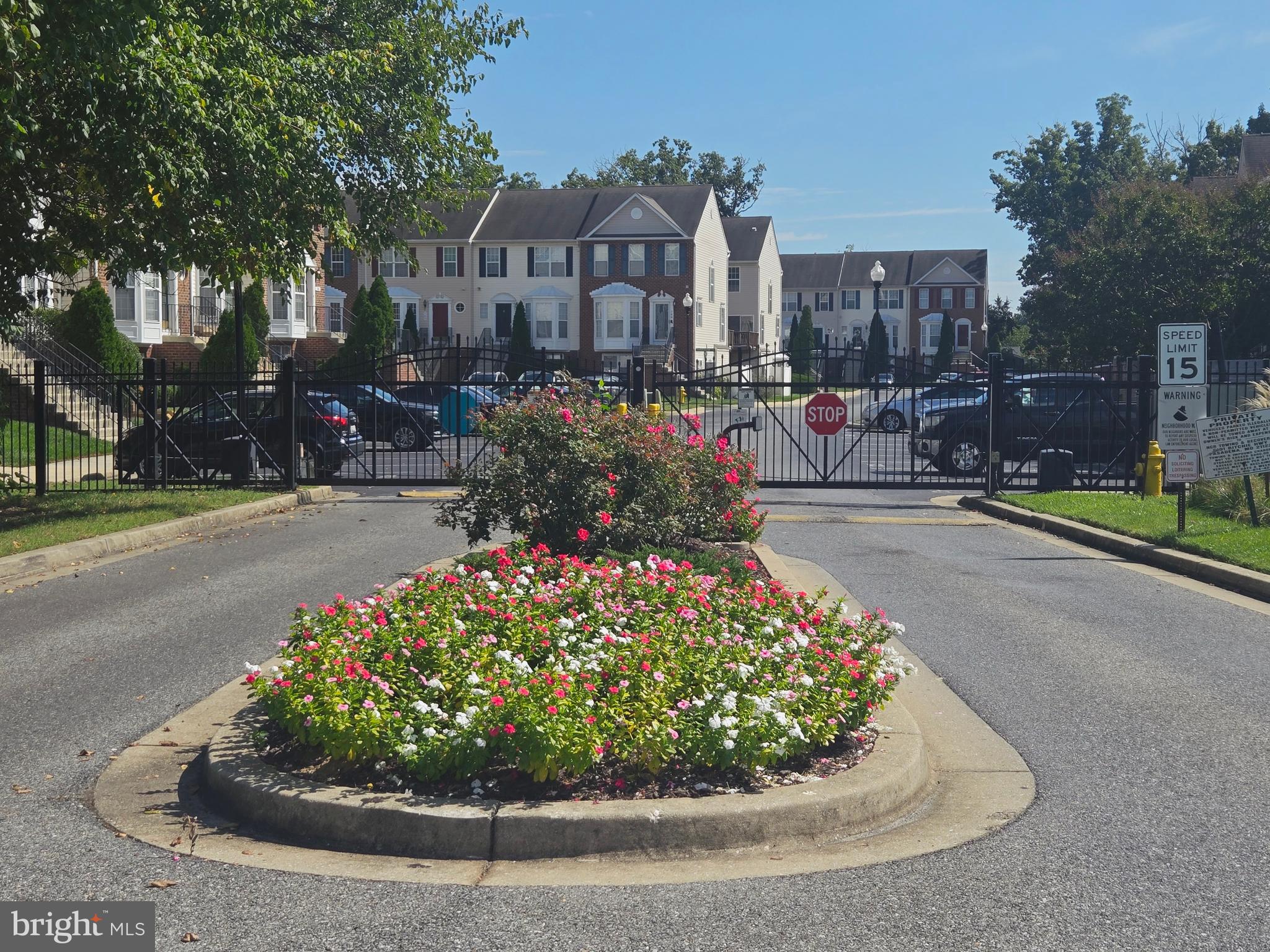 118 Heather Stone Way, Unit 80 Glen Burnie, MD 21061 - Photo 3 of 27 a view of a street with a bench and trees