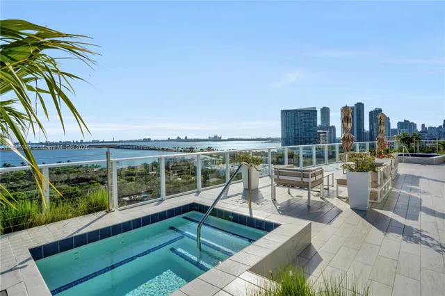 a view of a chairs and table in patio