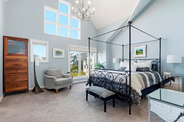 a bedroom with a bed a couch and dresser