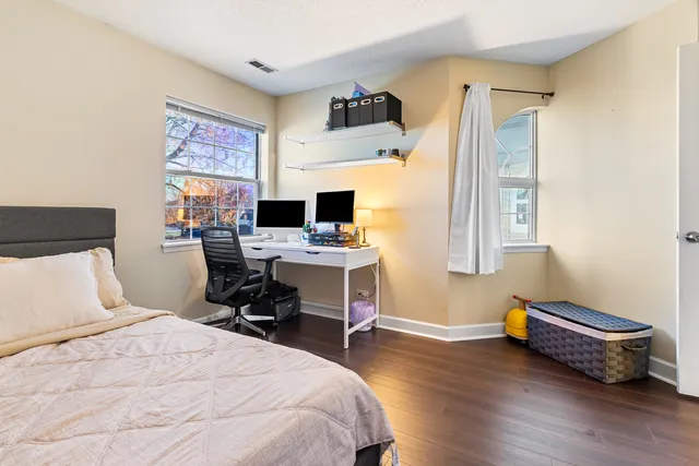 a bedroom with bed and a window