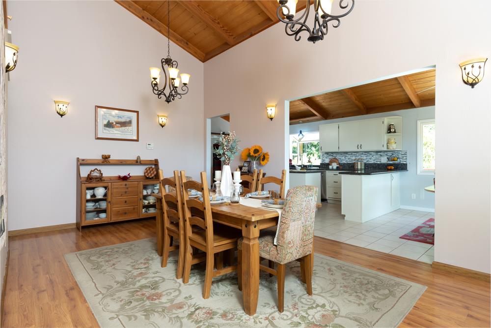 708 Ralston Ridge Boulder Creek, CA 95006 - Photo 12 of 59 a dining room with furniture and a chandelier