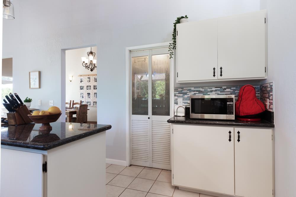 708 Ralston Ridge Boulder Creek, CA 95006 - Photo 14 of 59 a kitchen with stainless steel appliances granite countertop a stove a sink and a microwave