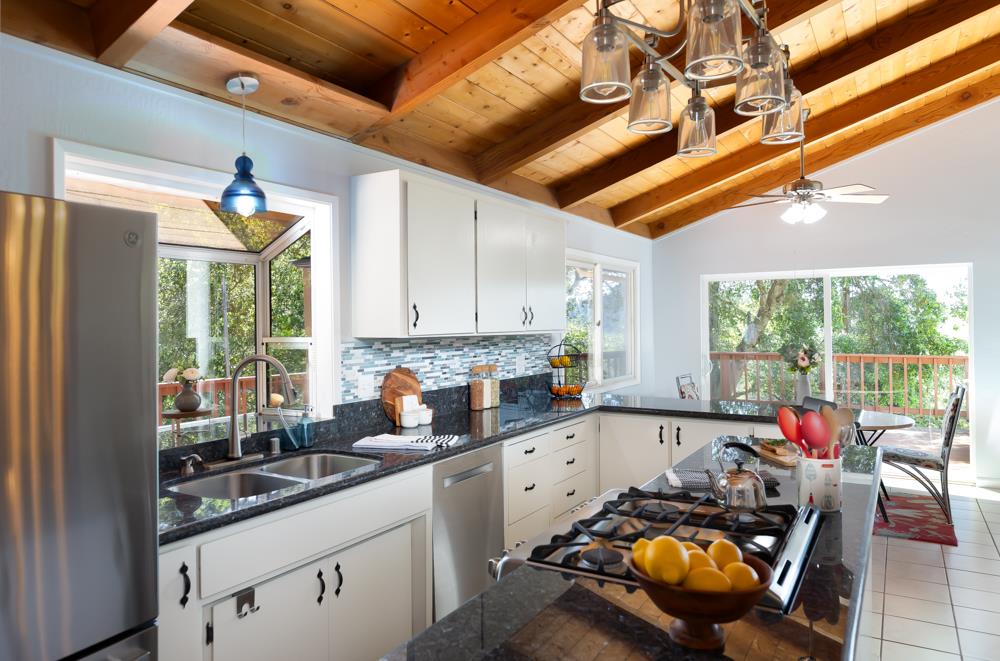708 Ralston Ridge Boulder Creek, CA 95006 - Photo 15 of 59 a kitchen with stainless steel appliances granite countertop a stove a sink and cabinets