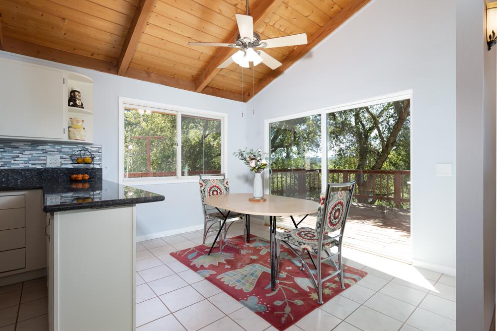 708 Ralston Ridge Boulder Creek, CA 95006 - Photo 16 of 59 a view of a dining room with furniture wooden floor and a chandelier