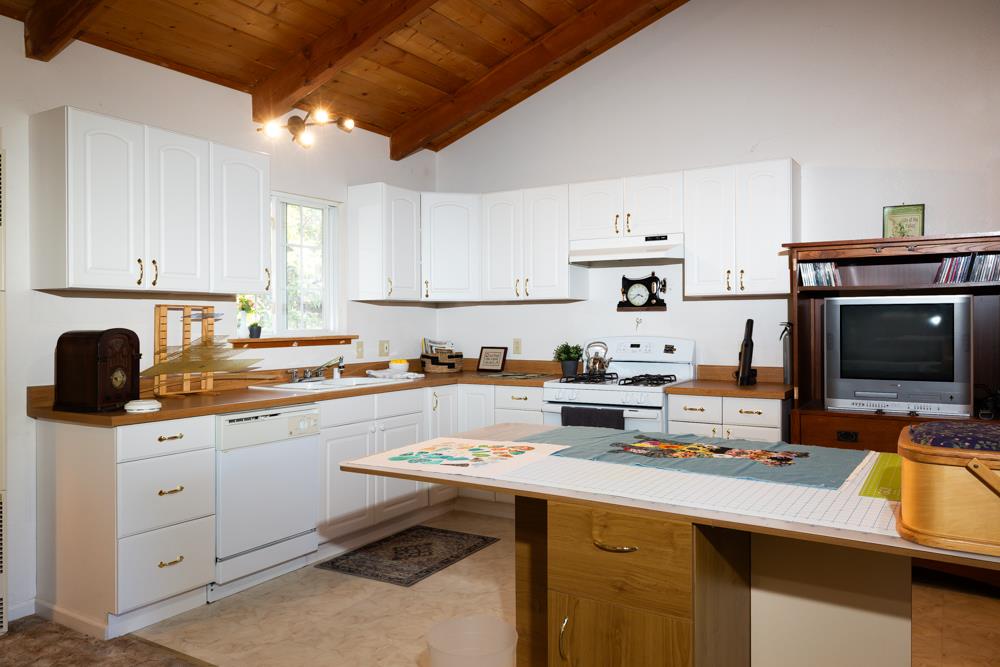 708 Ralston Ridge Boulder Creek, CA 95006 - Photo 32 of 59 a kitchen with a sink stove and cabinets