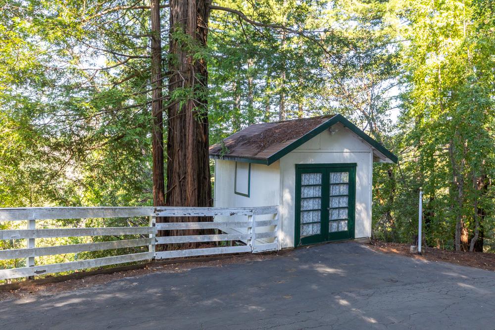708 Ralston Ridge Boulder Creek, CA 95006 - Photo 35 of 59 a front view of a house with a garden