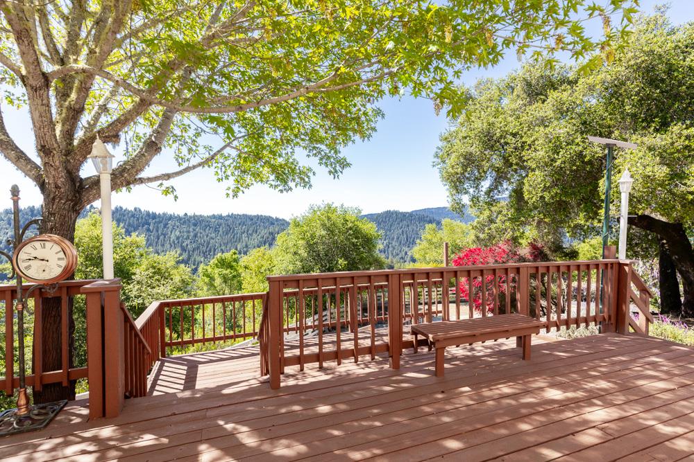 708 Ralston Ridge Boulder Creek, CA 95006 - Photo 40 of 59 a view of a street with wooden fence and a bench