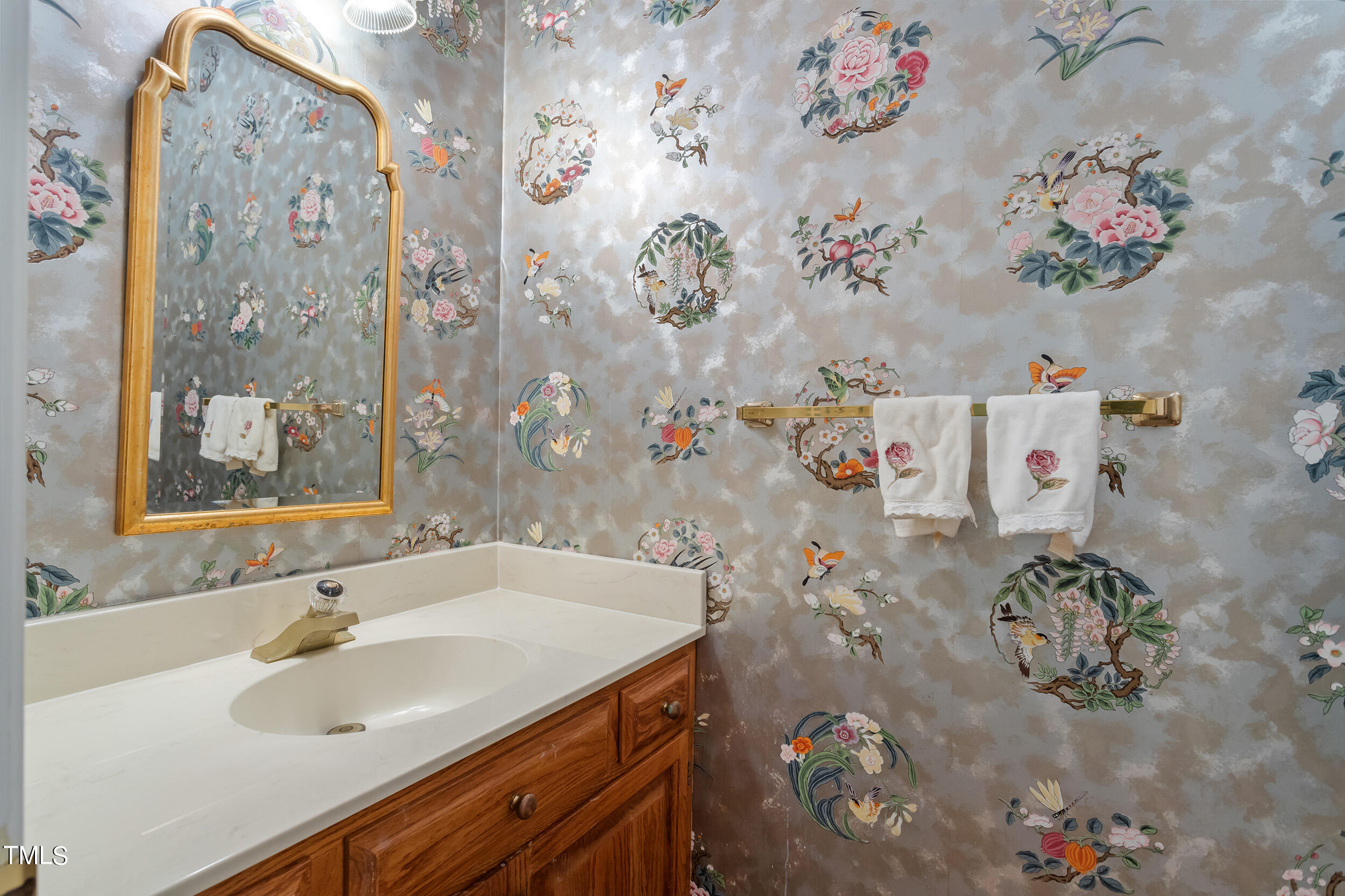 2617 Tatton Drive Raleigh, NC 27608 - Photo 22 of 41 a bathroom with a sink mirror and vanity