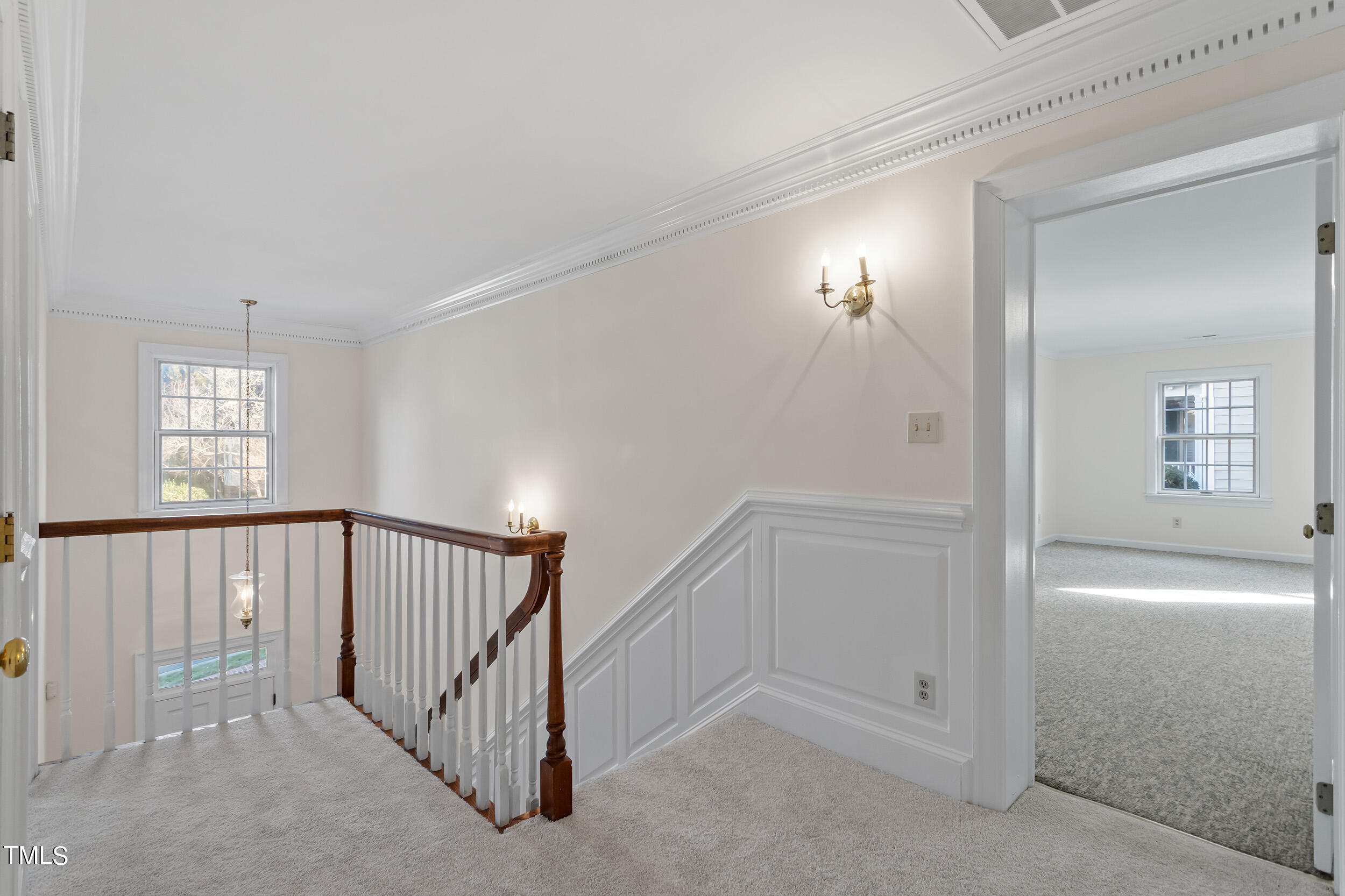 2617 Tatton Drive Raleigh, NC 27608 - Photo 28 of 41 a view of a hallway with windows