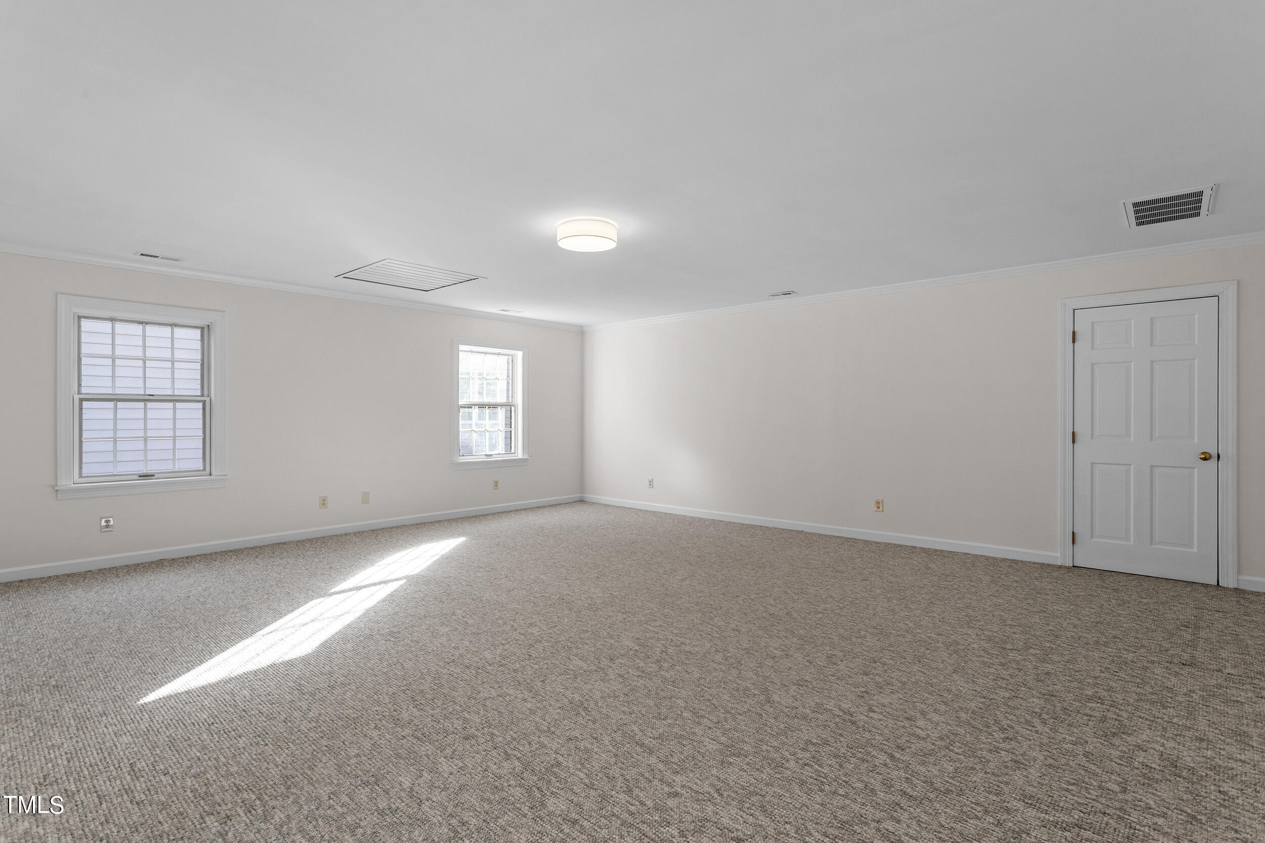 2617 Tatton Drive Raleigh, NC 27608 - Photo 37 of 41 a view of empty room with windows