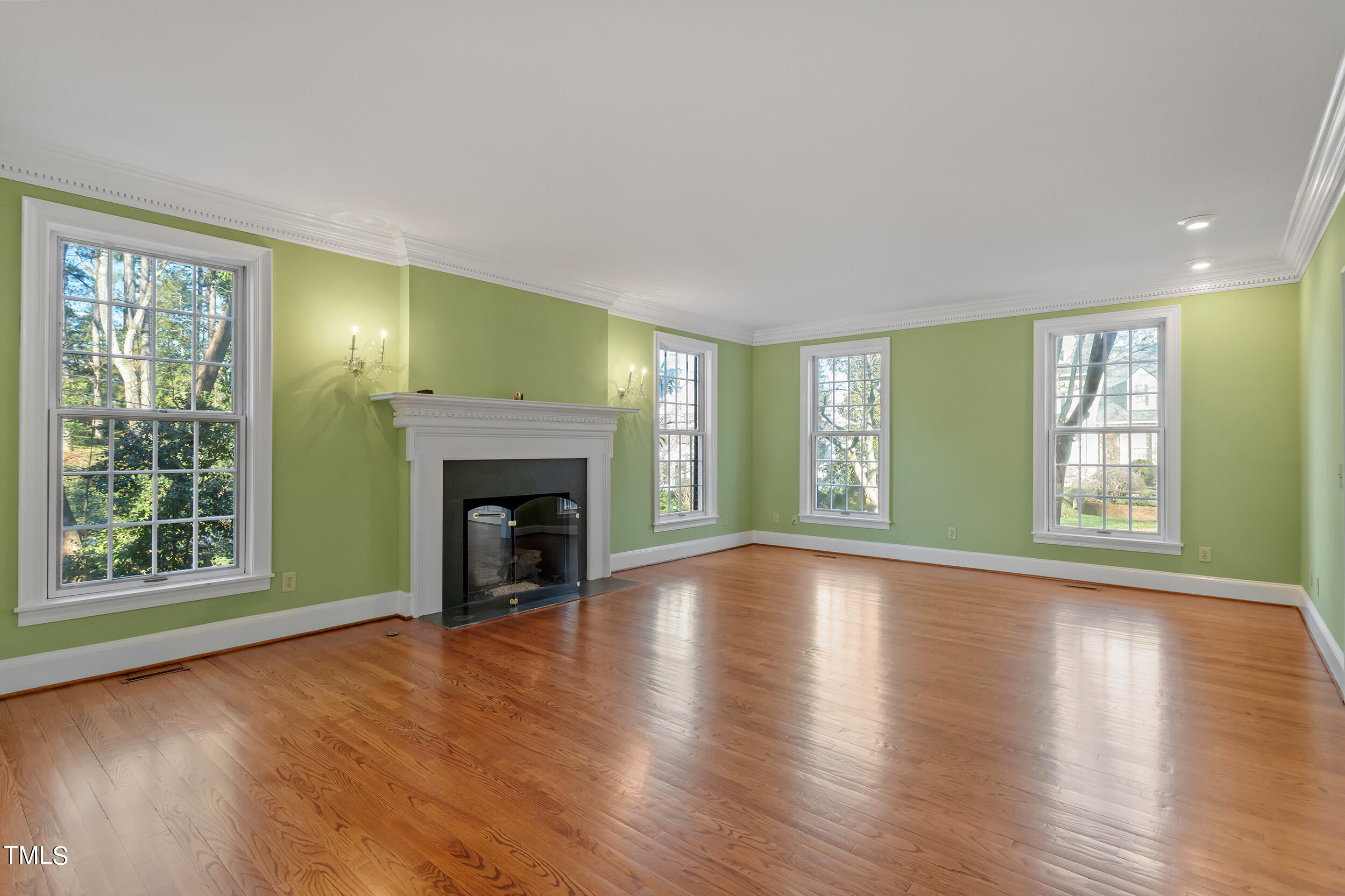 2617 Tatton Drive Raleigh, NC 27608 - Photo 9 of 41 a view of an empty room with window and fire place