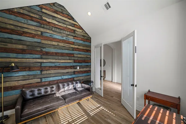 a view of room with wooden floor