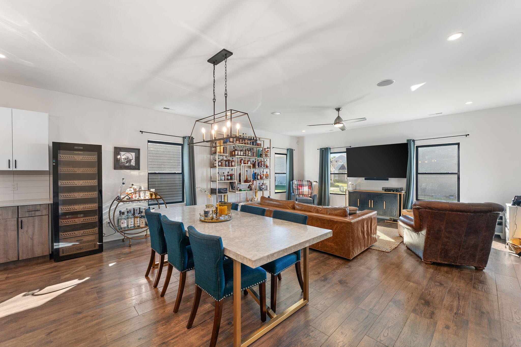 283 Nomo Place Crown Point, IN 46307 - Photo 12 of 35 a view of a dining room with furniture wooden floor and chandelier