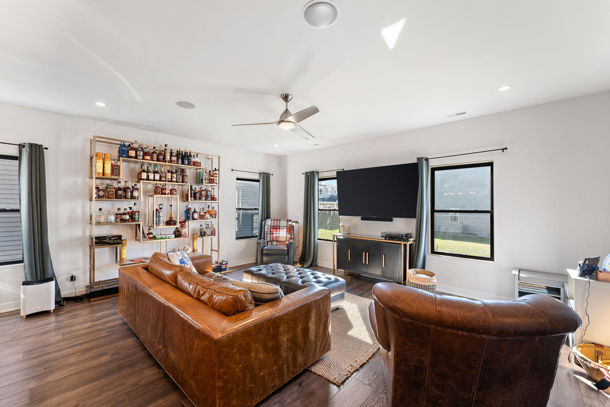 283 Nomo Place Crown Point, IN 46307 - Photo 13 of 35 a living room with furniture a flat screen tv and a fireplace