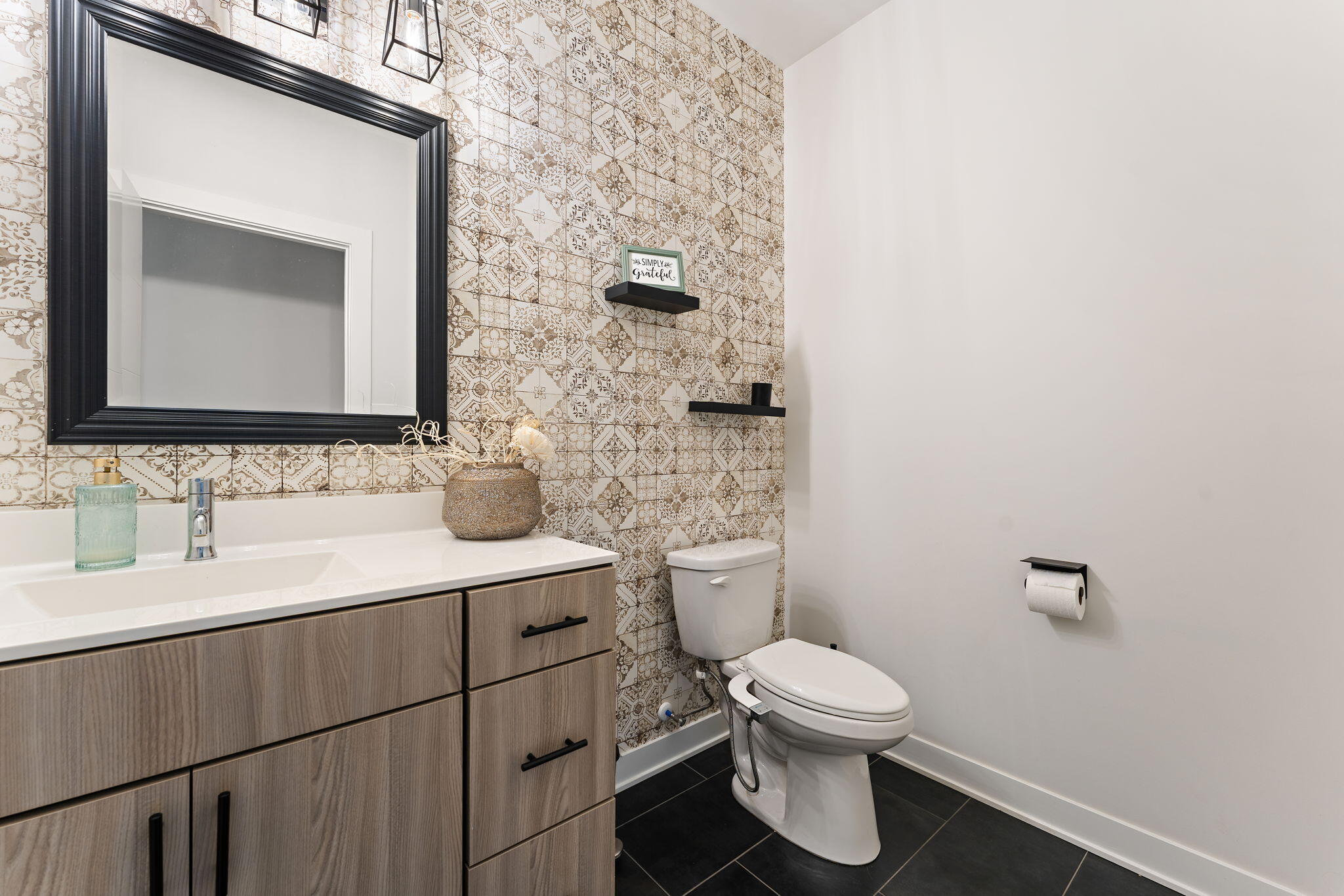 283 Nomo Place Crown Point, IN 46307 - Photo 18 of 35 a bathroom with a toilet sink and mirror