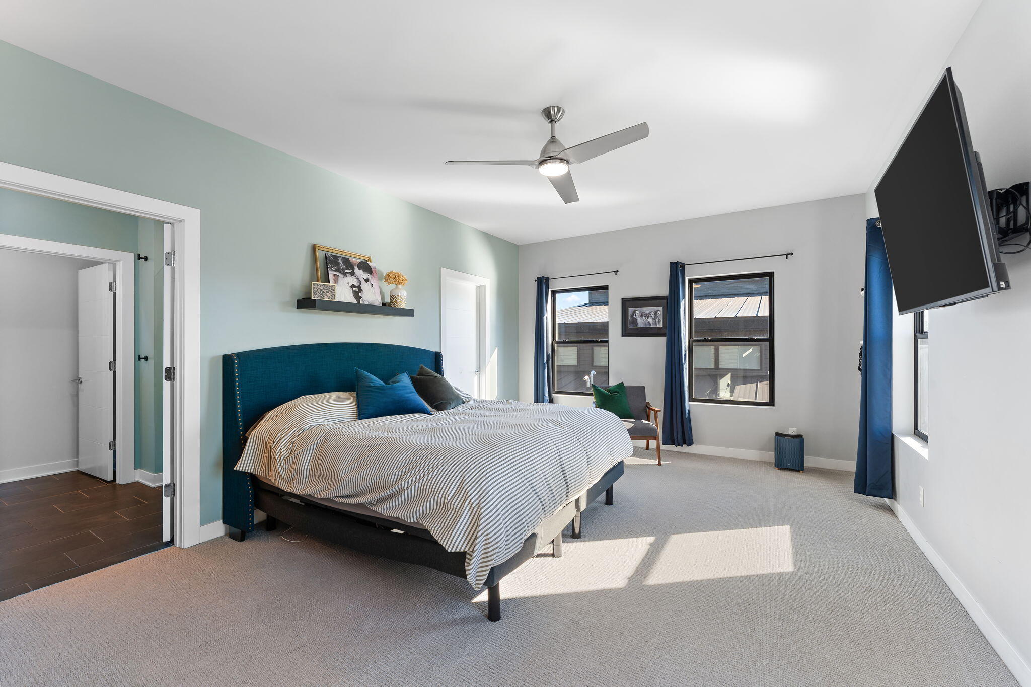 283 Nomo Place Crown Point, IN 46307 - Photo 21 of 35 a bedroom with a bed flat screen tv and a large window