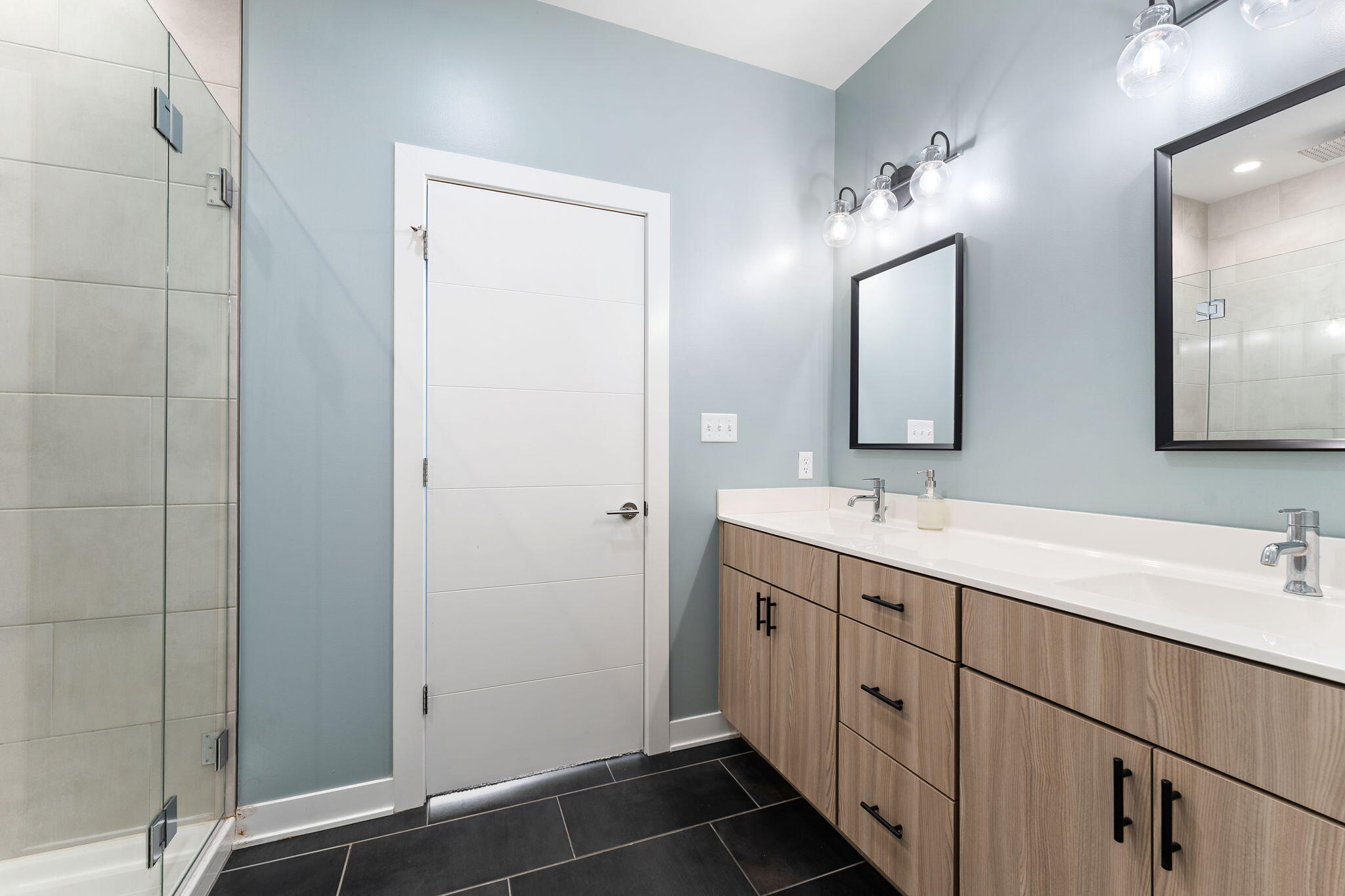 283 Nomo Place Crown Point, IN 46307 - Photo 25 of 35 a bathroom with a double vanity sink and mirror