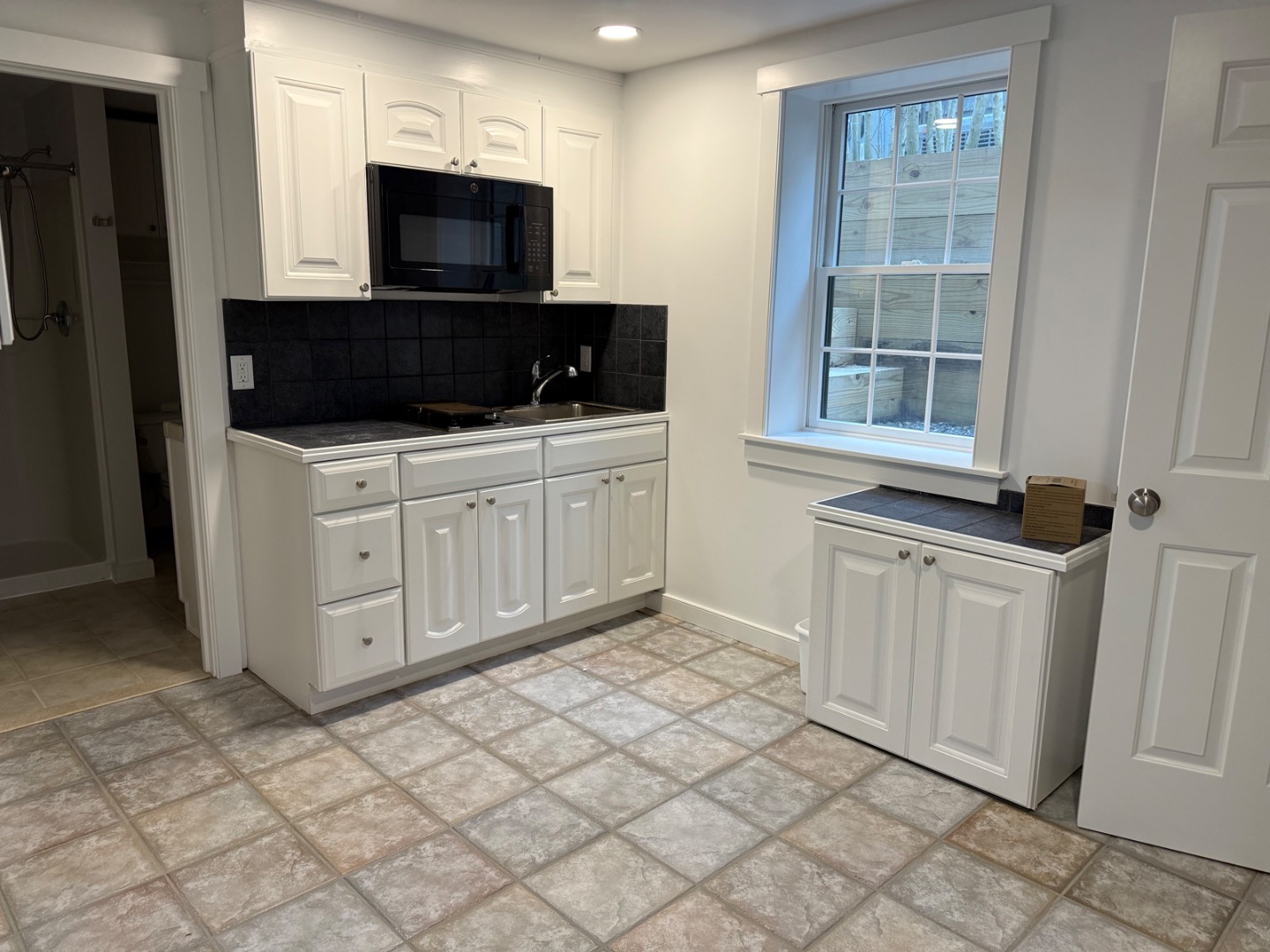 106 Old South Road, Unit A B Nantucket, MA 02554 - Photo 22 of 24 a view of a utility room with cabinets