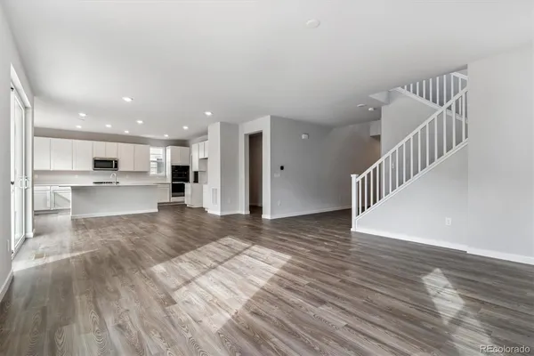 a view of kitchen and wooden floor