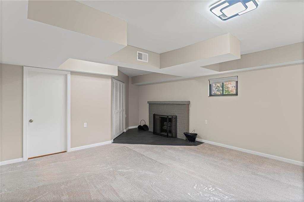 7872 Mt Carmel Road Verona, PA 15147 - Photo 34 of 50 Finished basement w wood burning fireplace