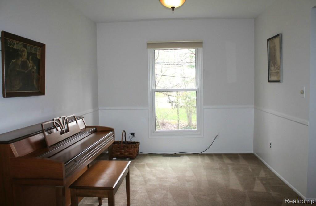 44727 Brookside Road Plymouth, MI 48170 - Photo 5 of 37 FORMAL DINING ROOM OPENS TO LIVING ROOM (POSSIBLE HARDWOOD UNDER CARPET)