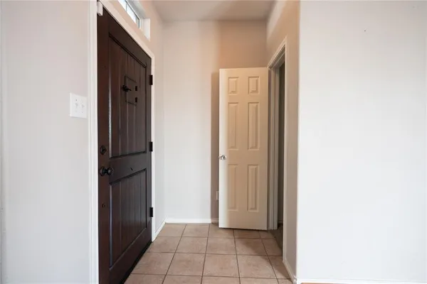a view of an entryway with kitchen