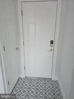 an empty room with an empty space and window