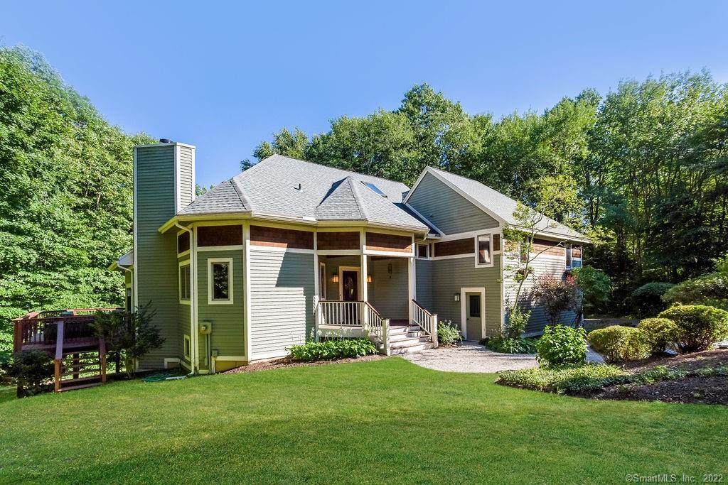 124 Westledge Road Simsbury, CT 06092 - Photo 1 of 1 Front view is so Nantucket with curved pea stone walk and blue stone stairs.